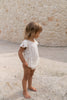US stockist of Illoura the Label's Blossom Romper in Natural