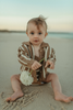 US stockist of Grown Clothing's gender neutral knitted Cedar button up cardigan.