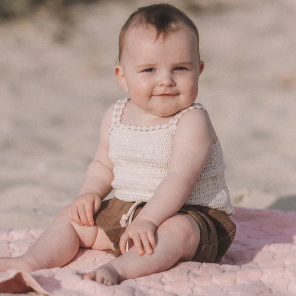 US stockist of Grown Clothing's hand crocheted romper in "Coconut"