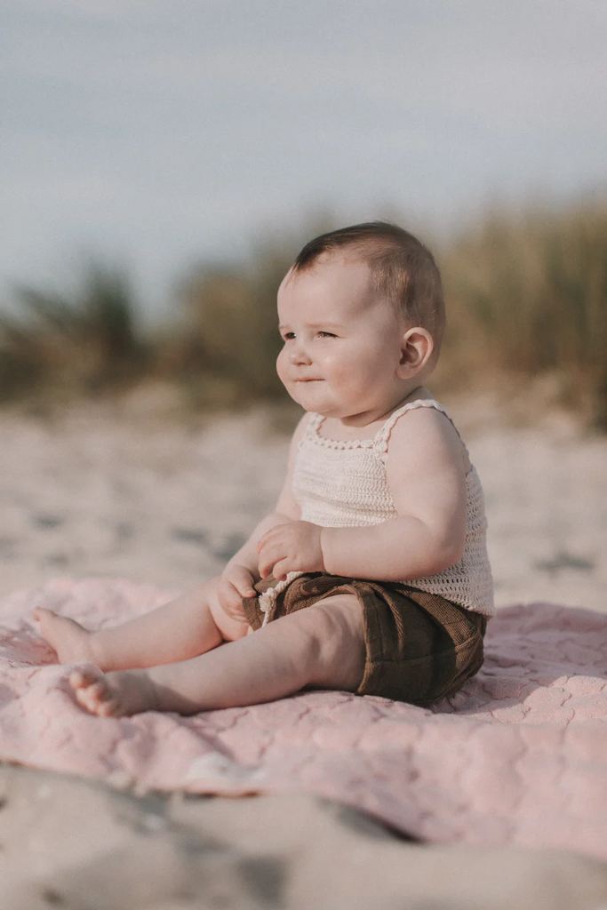 US stockist of Grown Clothing's hand crocheted romper in "Coconut"