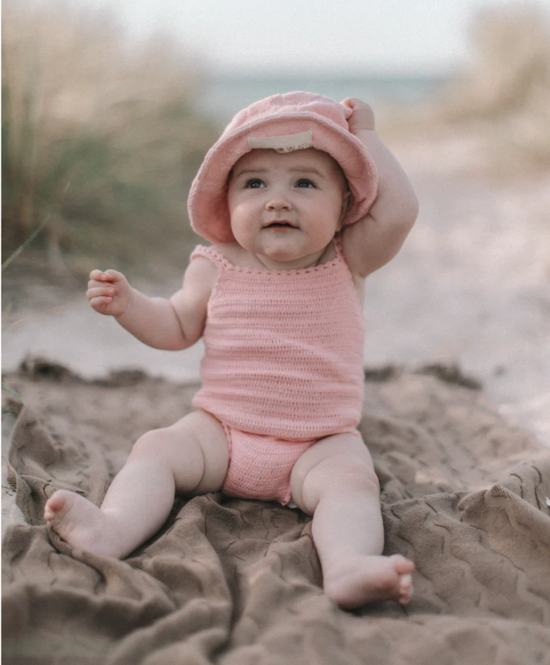 US stockist of Grown Clothing's hand crocheted romper in "Blossom"