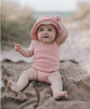 US stockist of Grown Clothing's hand crocheted romper in "Blossom"