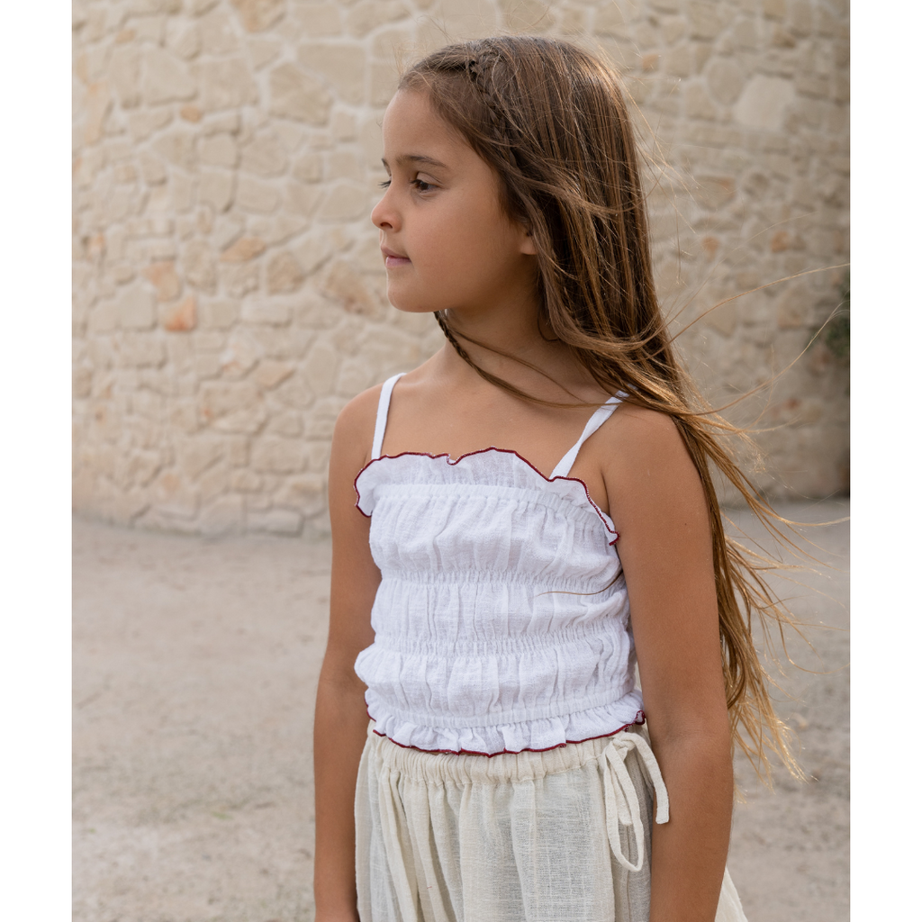 US stockist of Illoura the Label's White Shirred Crop Top