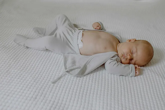 Stockist of Bonsie's organic cotton footed romper in Mist