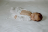 Stockist of Bonsie's organic cotton footed romper in Milk