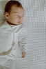 Stockist of Bonsie's organic cotton footed romper in Milk