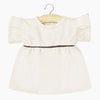 US stockist of Minikane's Daisy Dress in Ecru Corduroy
