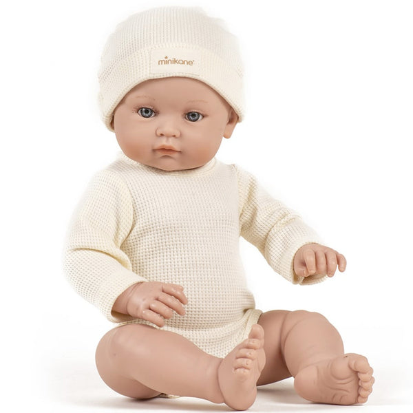 US stockist of Minikane's Bambini Andrea long sleeve bodysuit with matching hat in Ecru