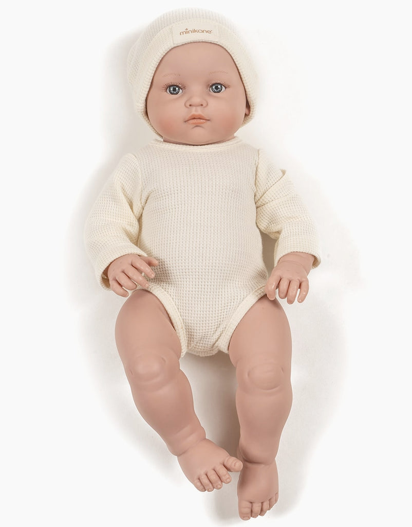 US stockist of Minikane's Bambini Andrea long sleeve bodysuit with matching hat in Ecru