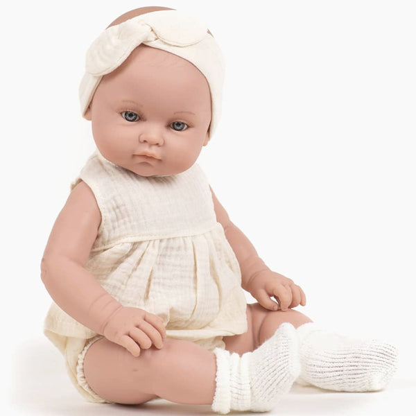 US stockist of Minikane's Yaelle Bambini Girl doll in her Ecru Charlotte set with matching headband.