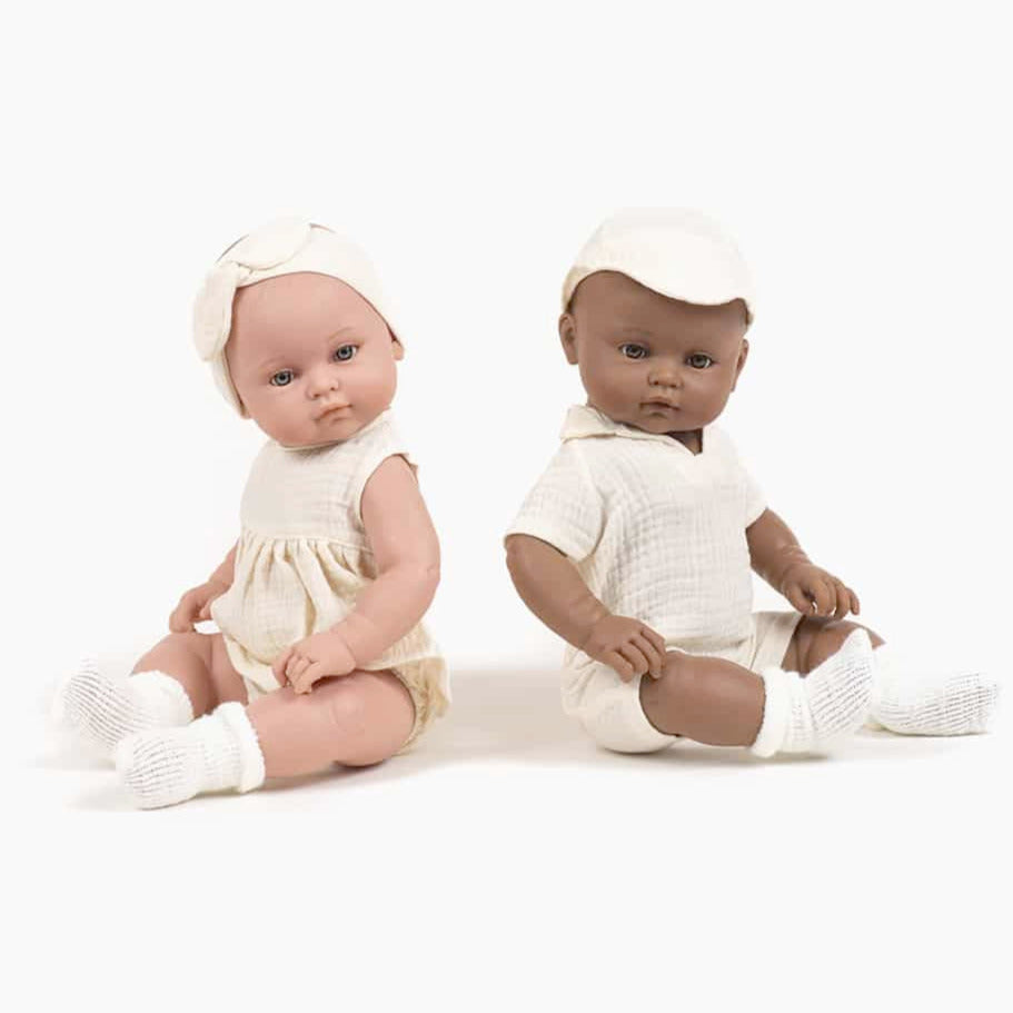 US stockist of Minikane's Yaelle Bambini Girl doll in her Ecru Charlotte set with matching headband.