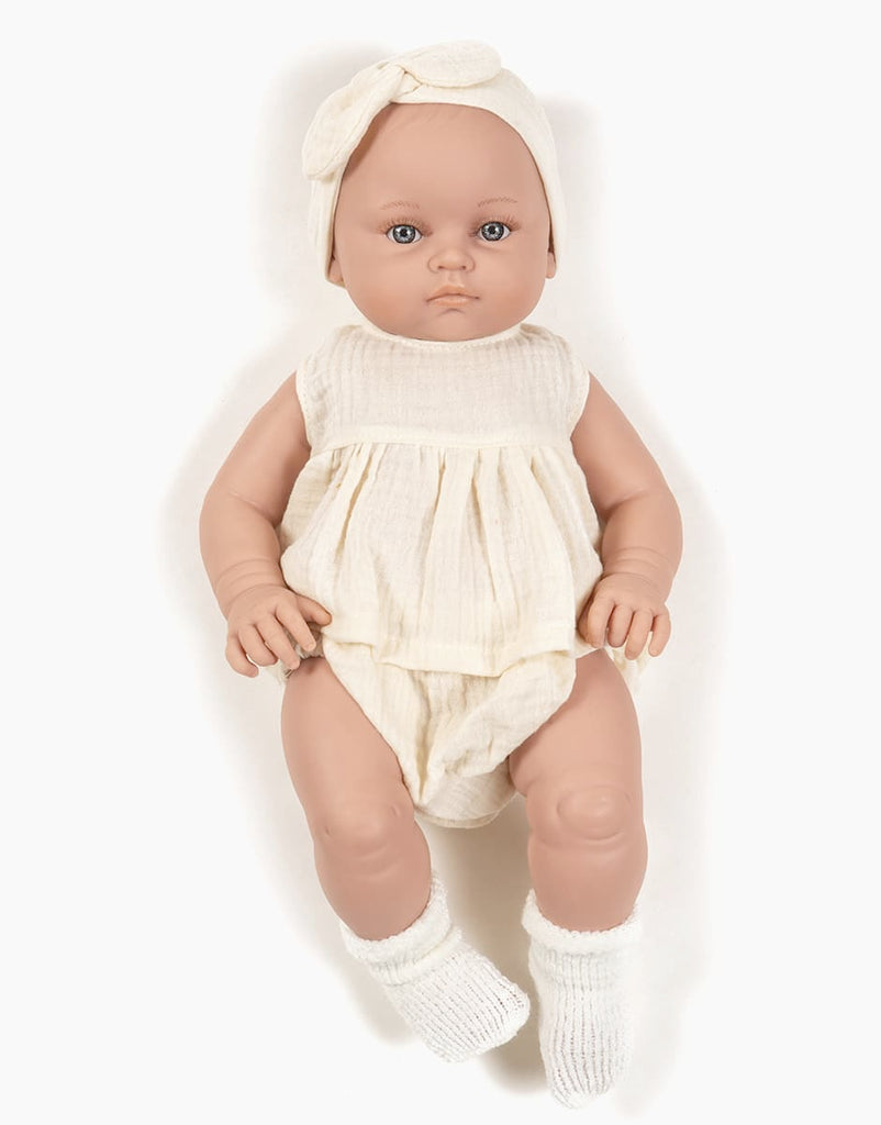 US stockist of Minikane's Yaelle Bambini Girl doll in her Ecru Charlotte set with matching headband.