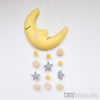 Decorative moon pillow with star and pom-pom mobile on a white background, branded 'tara treasures'.  US stockist of Tara Treasures.
