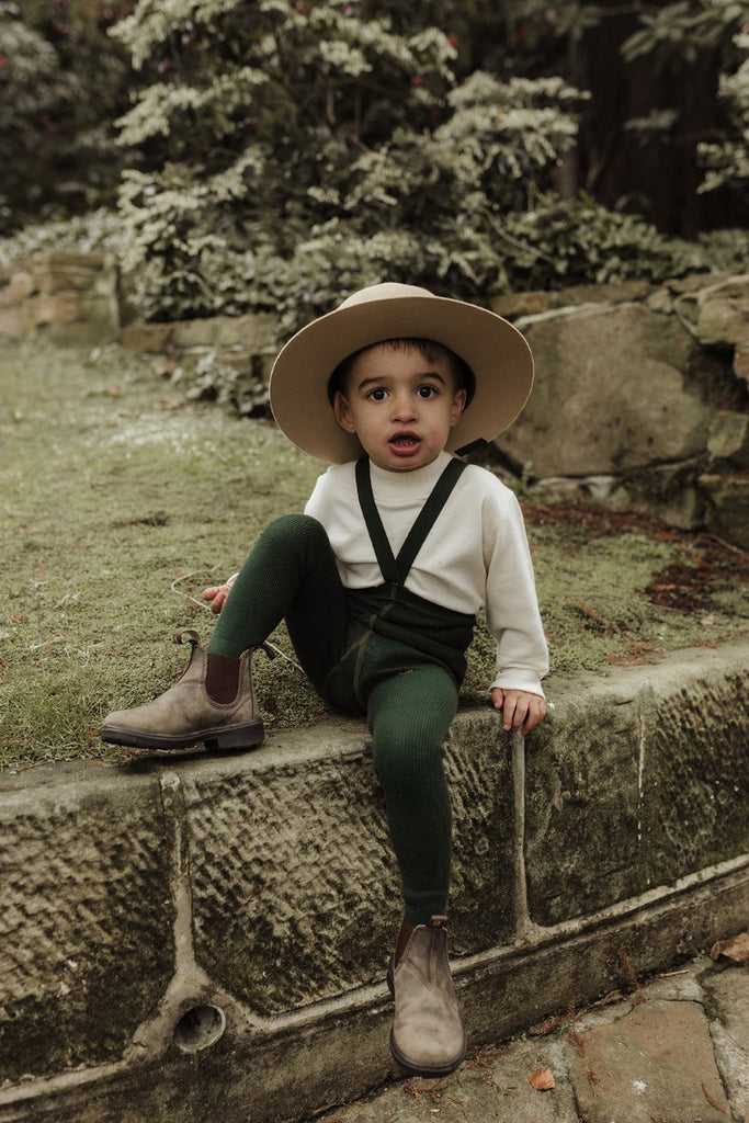 US stockist of Silly Silas' gender neutral, organic cotton footed tights in Dark Forest Green.