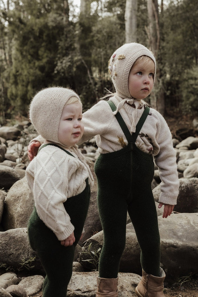 US stockist of Silly Silas' gender neutral, Teddy footed warmy tights in Dark Forest Green.