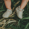 US stockist of Donsje USA's Elia premium handmade leather t-bar shoes.  Light stone in color with velcro fastening.  Sizes 0-12 mths have soft sole, 12-30mths have a soft flexible, rubber sole.