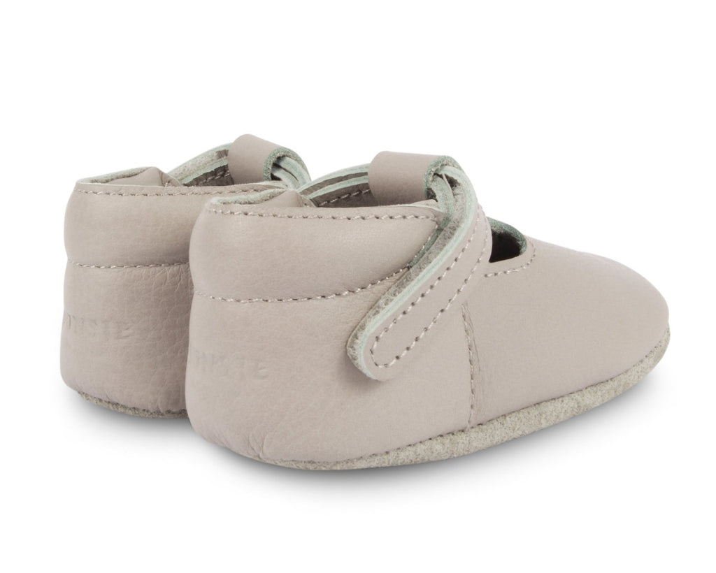US stockist of Donsje USA's Elia premium handmade leather t-bar shoes.  Light stone in color with velcro fastening.  Sizes 0-12 mths have soft sole, 12-30mths have a soft flexible, rubber sole.