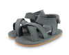 US stockist of Donsje USA's Giggles premium handmade leather nubuck sandals.  Petrol Grey in color with velcro fastening at back.  Sizes 0-12 mths have soft sole, 12-30mths have a soft flexible, rubber sole.