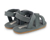 US stockist of Donsje USA's Giggles premium handmade leather nubuck sandals.  Petrol Grey in color with velcro fastening at back.  Sizes 0-12 mths have soft sole, 12-30mths have a soft flexible, rubber sole.