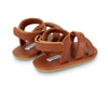 US stockist of Donsje USA's Giggles premium handmade leather sandals.  Cream in color with velcro fastening at back.  Sizes 0-12 mths have soft sole, 12-30mths have a soft flexible, rubber sole.