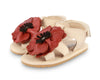 US stockist of Donsje USA's Poppy Tuti Fields premium handmade leather sandals.  Cream in color with beautiful red poppy on front and velcro fastening at back.  Sizes 0-12 mths have soft sole, 12-30mths have a soft flexible, rubber sole.