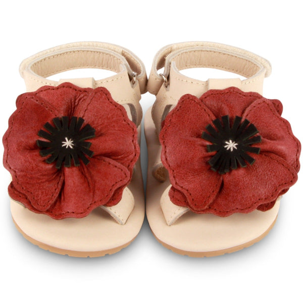 US stockist of Donsje USA's Poppy Tuti Fields premium handmade leather sandals.  Cream in color with beautiful red poppy on front and velcro fastening at back.  Sizes 0-12 mths have soft sole, 12-30mths have a soft flexible, rubber sole.