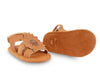 US stockist of Donsje USA's Poppy Tuti Fields premium handmade leather sandals.  Tan in color with a lovely tan sunflower on front and velcro fastening at back.  Sizes 0-12 mths have soft sole, 12-30mths have a soft flexible, rubber sole.