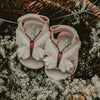US stockist of Donsje USA's Butterfly Tuti Sky  premium handmade leather sandals.  Pink in color with beautiful cream/pink butterfly on front and velcro fastening at back.  Sizes 0-12 mths have soft sole, 12-30mths have a soft flexible, rubber sole.