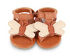 US stockist of Donsje USA's Honey Bee Tuti Sky  premium handmade leather sandals.  Tan in color with beautiful tan/cream honey bee on front and velcro fastening at back.  Sizes 0-12 mths have soft sole, 12-30mths have a soft flexible, rubber sole.