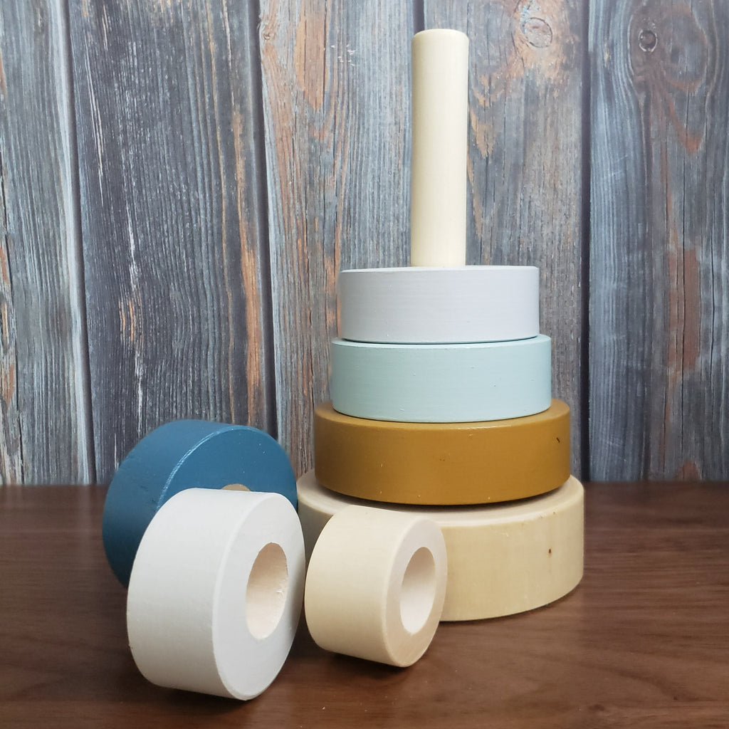 US stockist of Children of the Trees hand painted ring stacker wooden toy in blues and with a striking gold ring