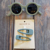 US stockist of Grech & Co's gender neutral sustainable sunglasses.  Made from recycled plastic, with round grey lens with UV 400 protection in a light blue color.