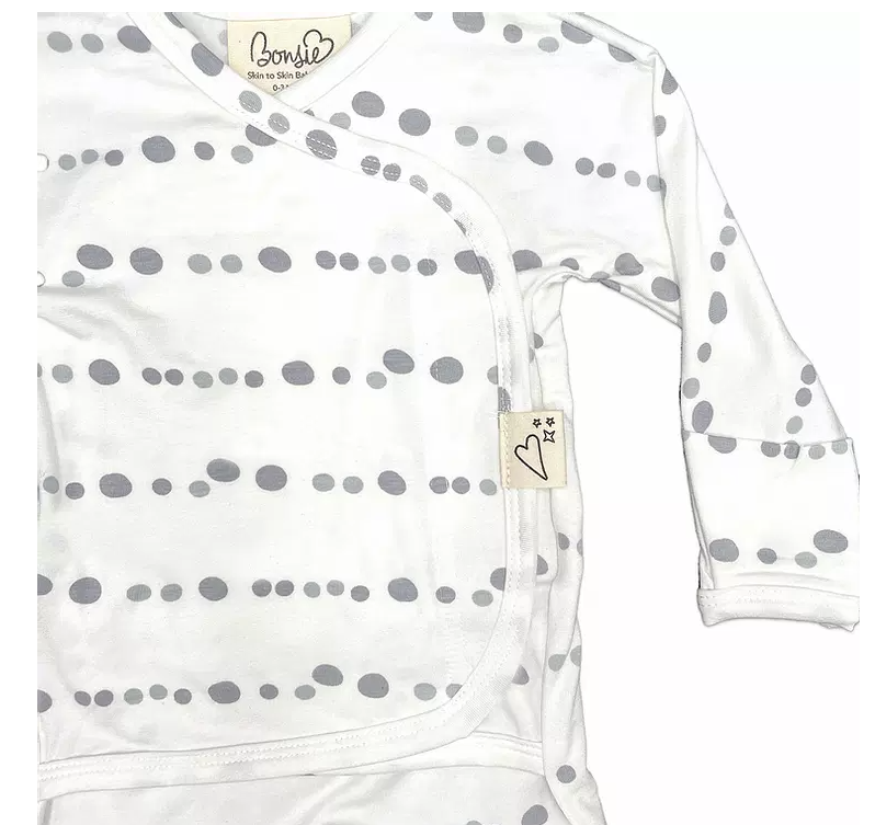 Stockist of Bonsie's rayon blend skipping stone print footie.  Top section has velcro wrap body which can be undone for skin to skin contact.  Elastic waist that can be pulled down for easy diaper changes. 