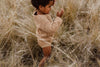 US stockist of Grown Clothing's gender neutral chunky knit rib bloomers in warm brown. Made from 100% cotton with an elastic waistband and two mock wooden buttons.