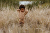 US stockist of Grown Clothing's gender neutral chunky knit rib bloomers in warm brown. Made from 100% cotton with an elastic waistband and two mock wooden buttons.
