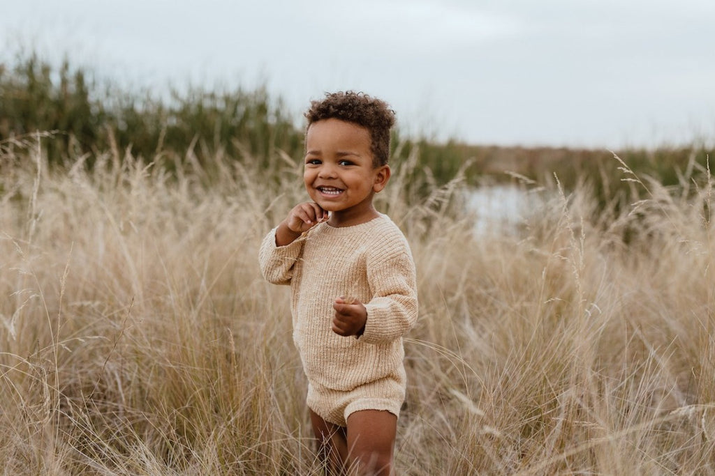 US stockist of Grown Clothing's gender neutral chunky knit rib bloomers in tan. Made from 100% cotton with an elastic waistband and two mock wooden buttons.