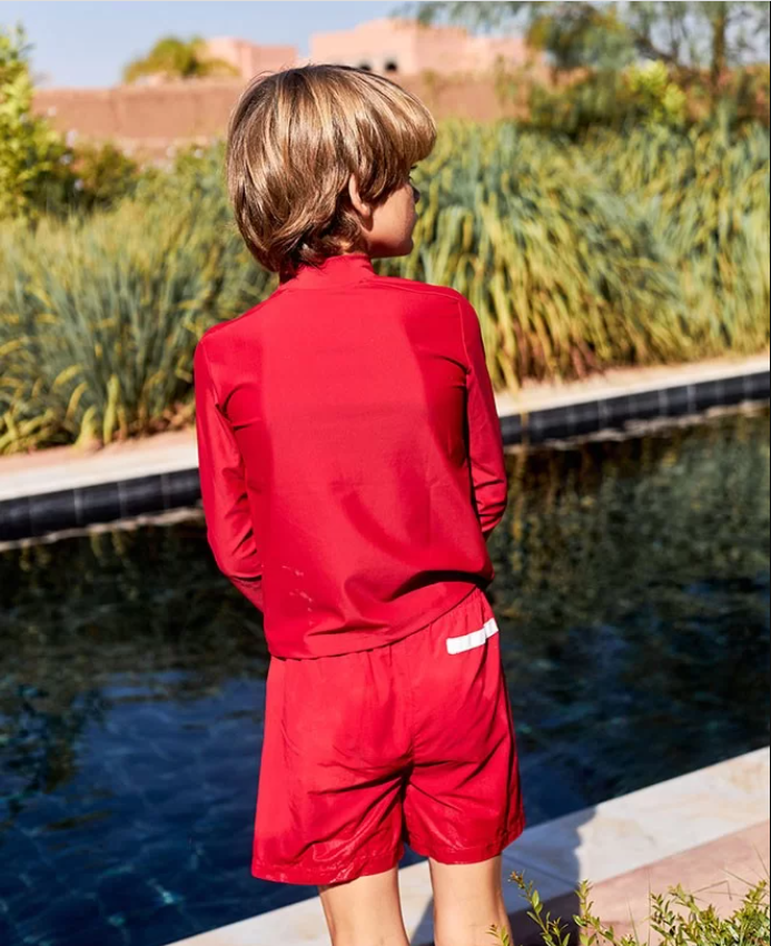 US stockist of Canopea's long sleeved, gender neutral, Turbot rash top in Pepper Red.