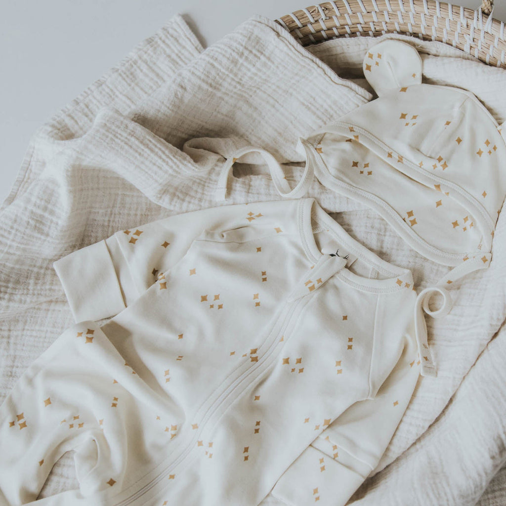 US stockist of Buck & Baa's gender neutral, organic cotton zip romper in Stardust.
