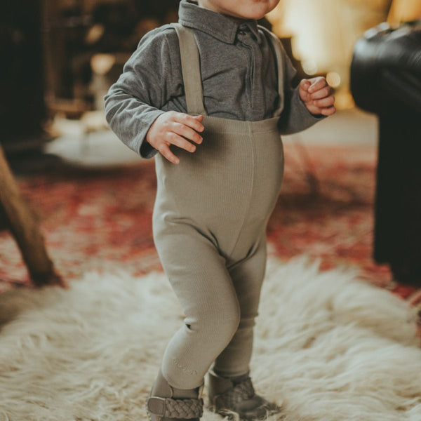 US stockist of Donsje's gender neutral, Dena ribbed suspender leggings in Green Oak.