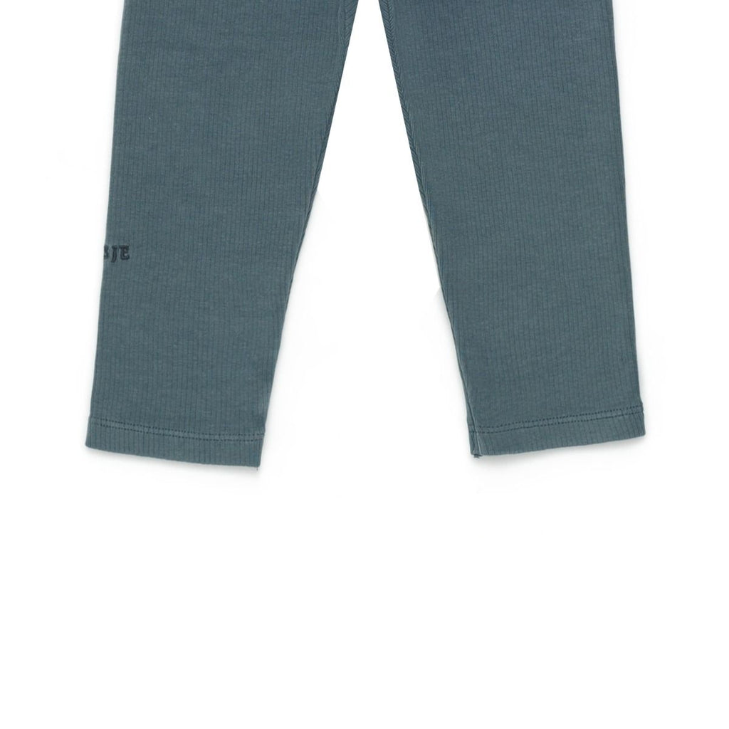 US stockist of Donsje's gender neutral, Dena ribbed suspender leggings in Dark Spruce