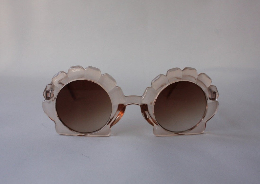 US stockist of Elle Porte's Shelly sunglasses in peach.  Shell shaped frames with brown UV 400 lenses.