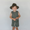 US stockist of Buck & Baa's organic dappled henley tank top.  Made from organic cotton and elastane in a blue/green color with all over spotted print. Coconut buttons on front placket.