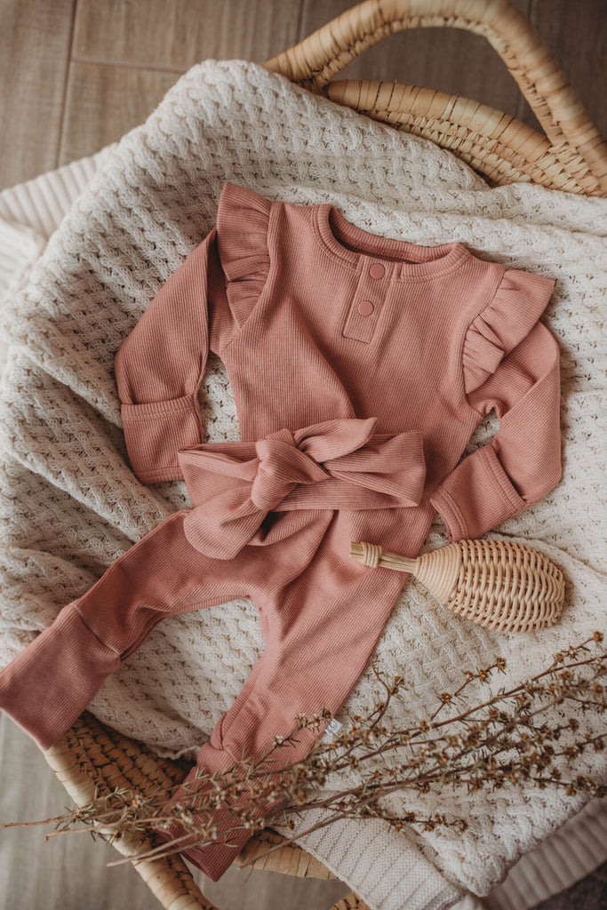 US stockist of Snuggle Hunny Kid's organic cotton jersey, rose ruffle zip footed sleeper.