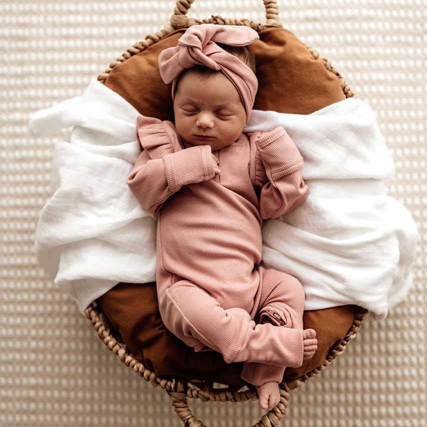 US stockist of Snuggle Hunny Kid's organic cotton jersey, rose ruffle zip footed sleeper.