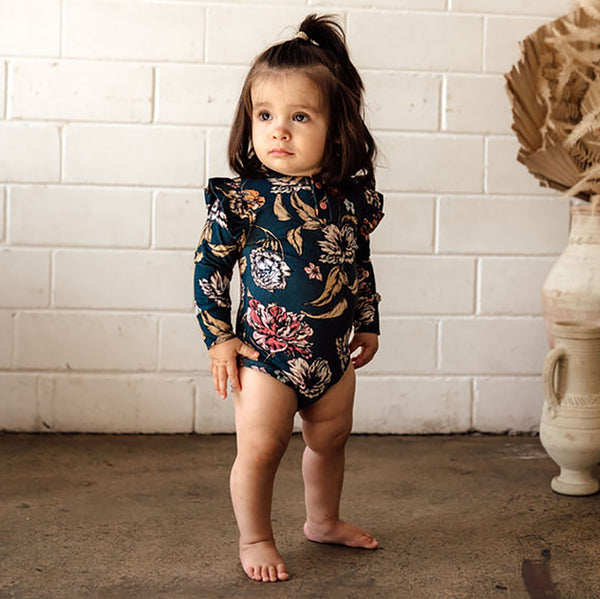 US stockist of Snuggle Hunny Kid's organic long sleeve ruffle bodysuit in Belle.