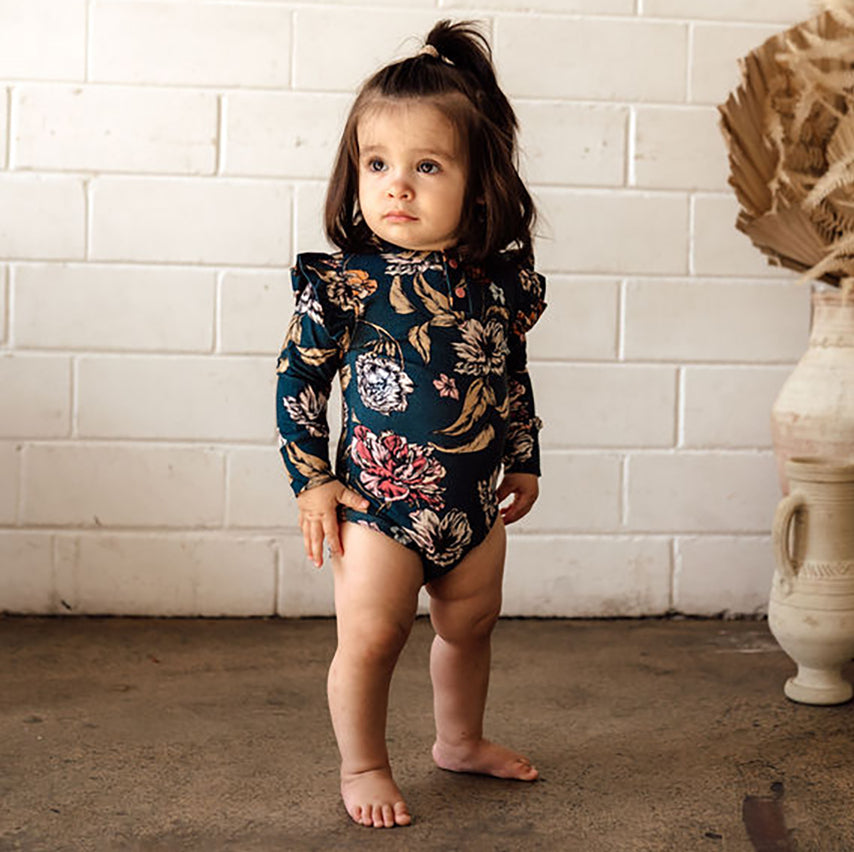 US stockist of Snuggle Hunny Kid's organic long sleeve ruffle bodysuit in Belle.