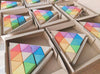 US stockist of Ocamora set of Triangular Colored Prism blocks.  Set of 12 colored blocks and 4 natural blocks that come in a tray.