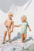 The US stockist of Zulu & Zephyr Mini Rib Onesie in Marine.  A loose fit gender neutral style made from sustainable ECONYL UPF 50+ fabric.  Short sleeved with contrasing back zipper and binds.  Fully lined.