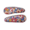 US stockist of Josie Joan's Amelia fabric hair clips.  Set of two fabric hair clips made from pale coloured fabric with multicolored flowers and  contrasting blue leaves.  Has scalloped edging.