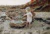 US stockist of Grown Clothing's gender neutral, organic cotton ribbed button bodysuit in Natural.