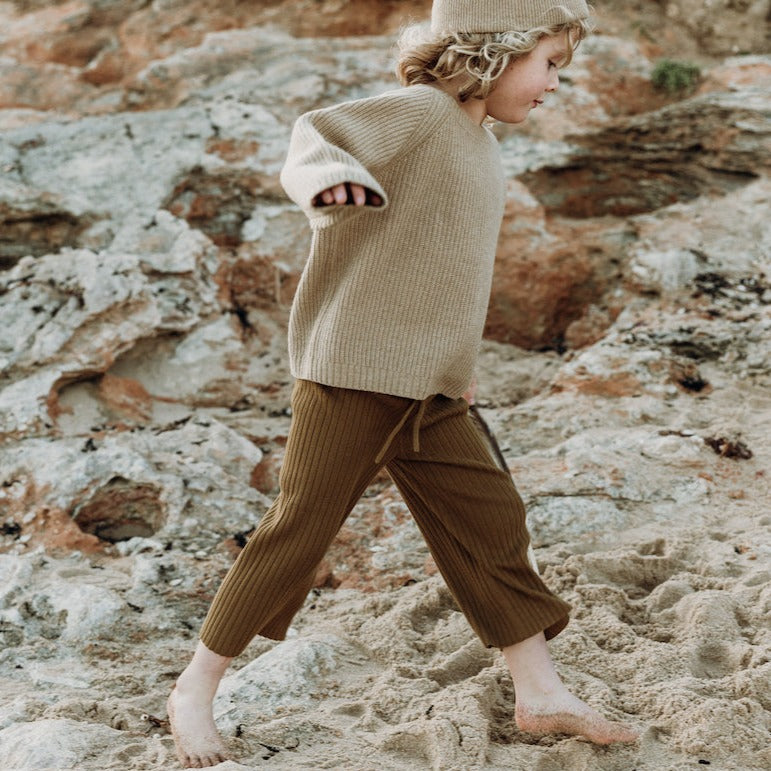 US stockist of Grown Clothing's gender neutral cotton Rib Flare Pants in Moss.